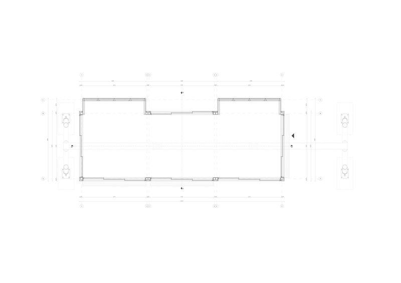 Floor plan drawing of a rectangular volume with dimension annotations and fixtures at the corners