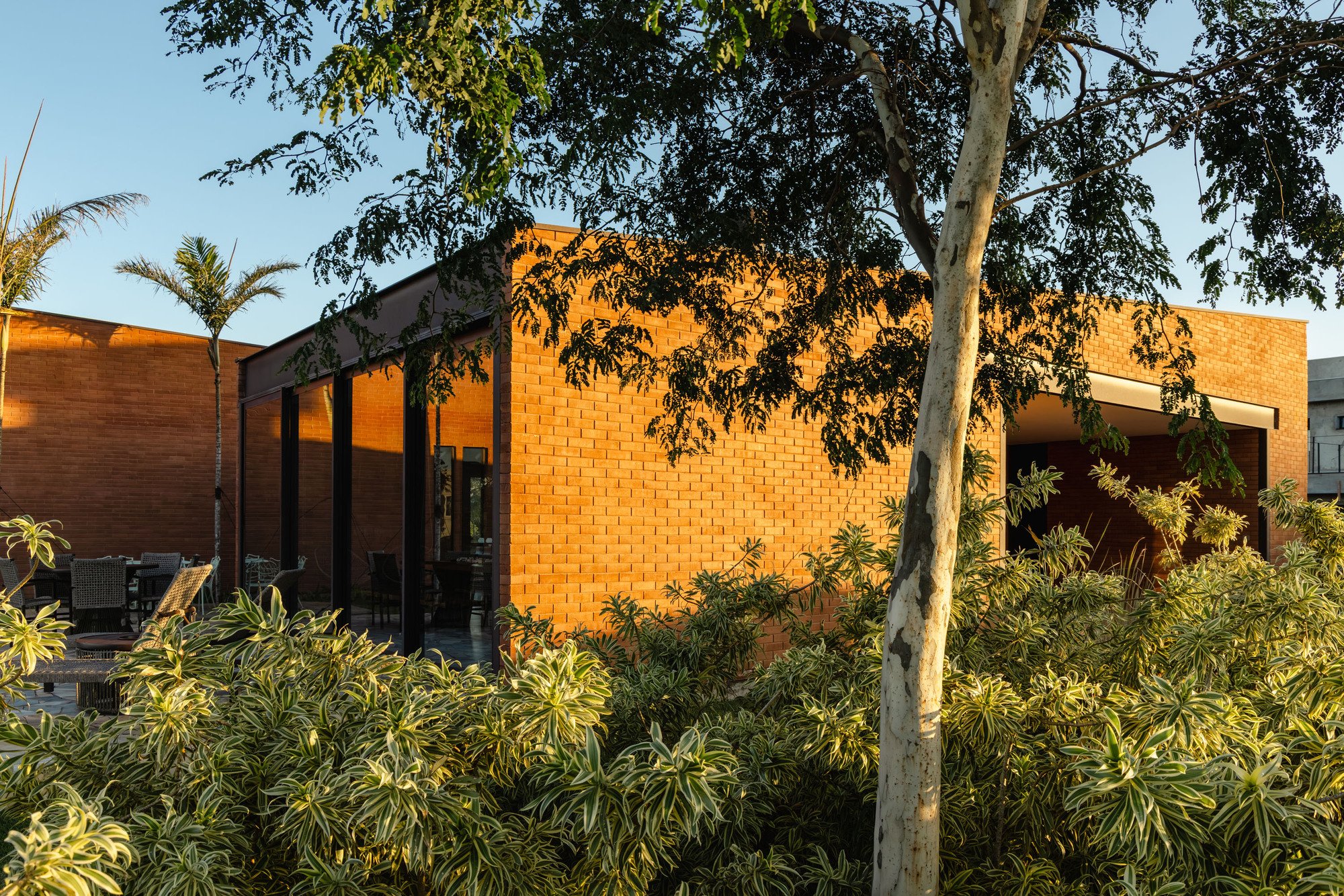 Sergio Sampaio and Tectônica Set Two Brick Volumes on a Raised Plateau in Rural São Paulo