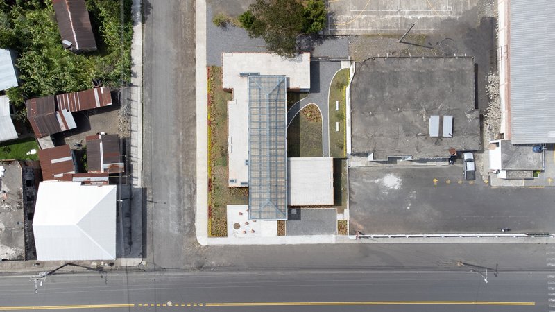 Aerial view of the rectangular building with glazed entrance courtyard and adjacent street frontage