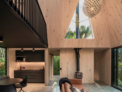 Fabric Reimagines the Gold Miner's Hut as a 46 m² Retreat in New Zealand's Subtropical Bush