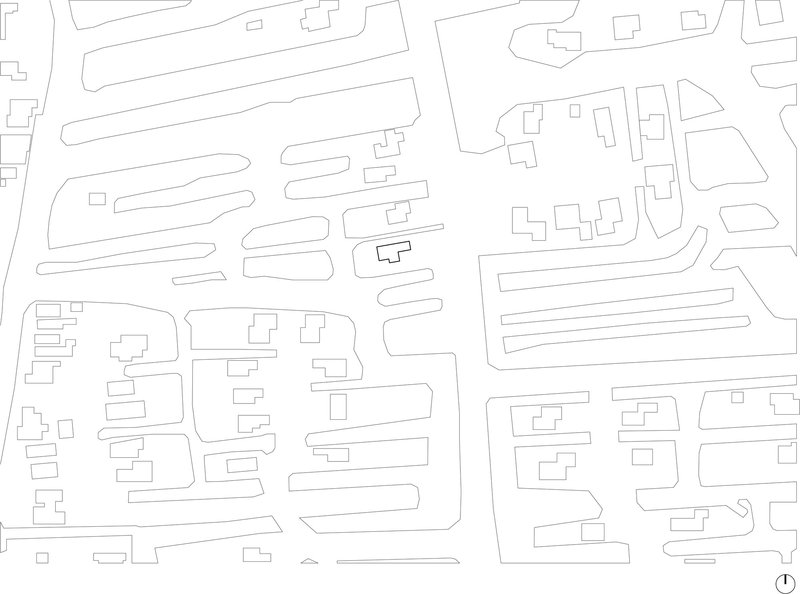 Site plan drawing showing building footprints and street layout in line art