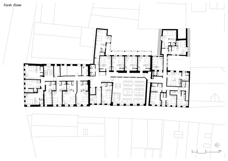 First floor plan drawing showing residential units arranged in a linear corridor configuration