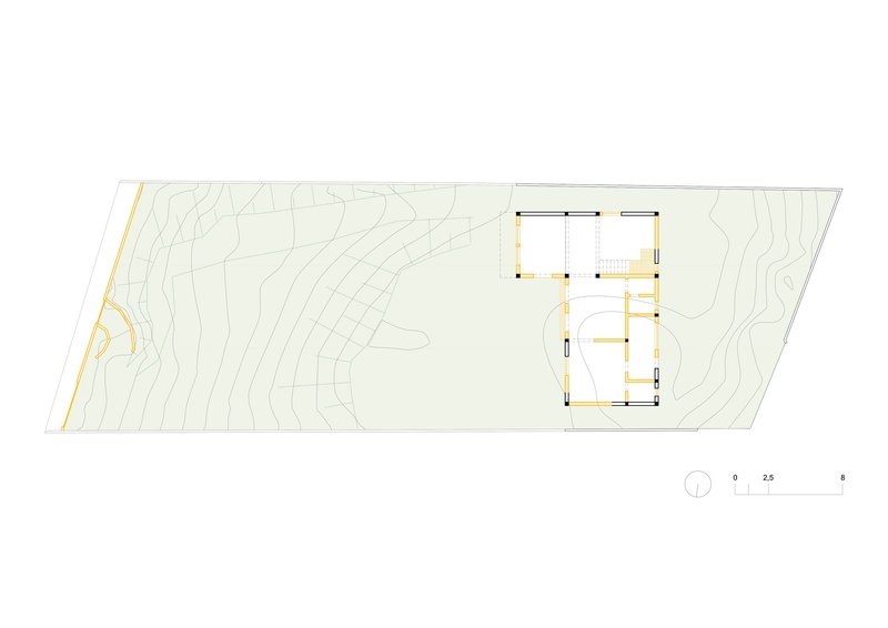 Floor plan drawing showing the building footprint with topographic contour lines on the hillside site