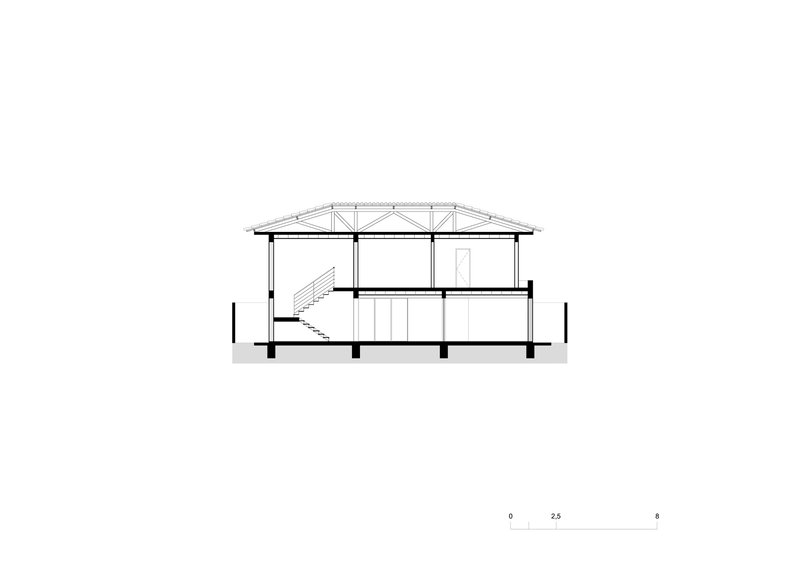 Section drawing illustrating a two-story interior with a pitched roof and exposed trusses