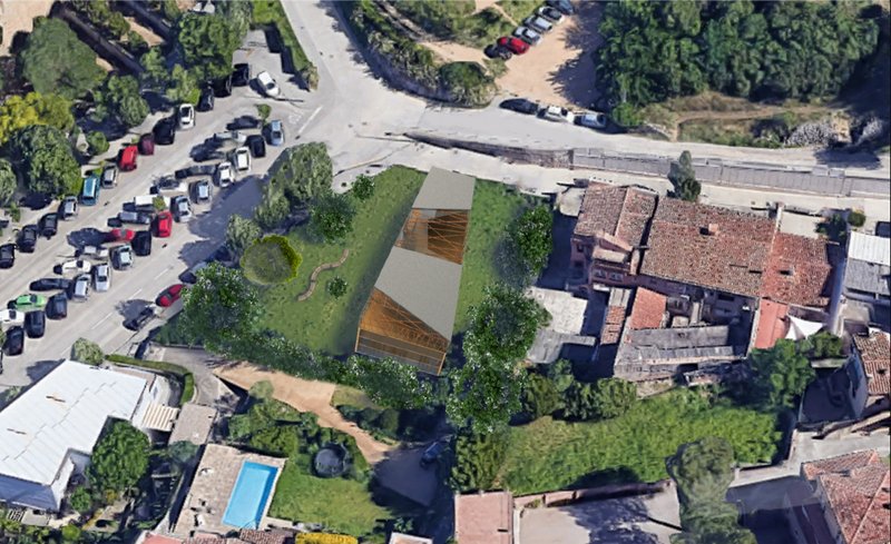Aerial context showing Biblio placed within Girona’s green urban fabric.