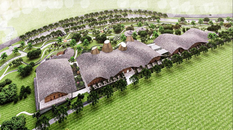 An aerial view reveals the village as a connected landscape of culture, learning, and coexistence.
