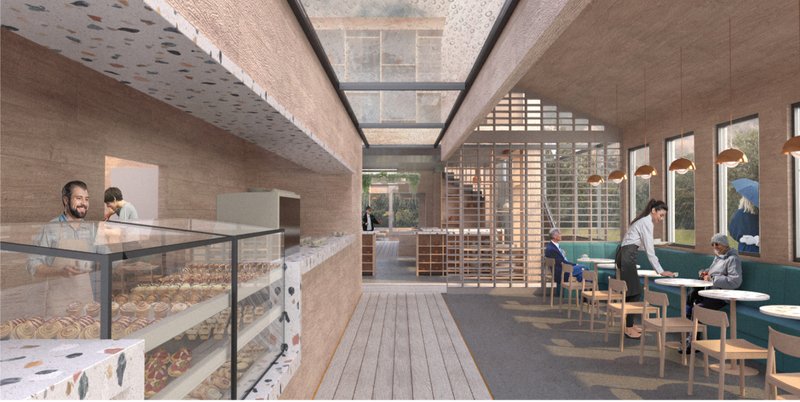 Entrance corridor combining bakery display, seating, skylight, and transparent circulation through the cafe.