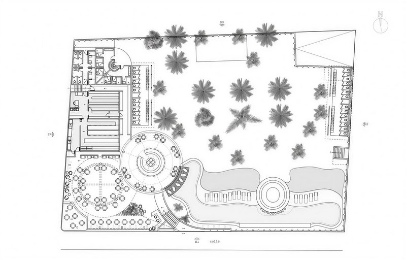 Site plan drawing showing circular dining pavilion, pool, and palm tree courtyard layout