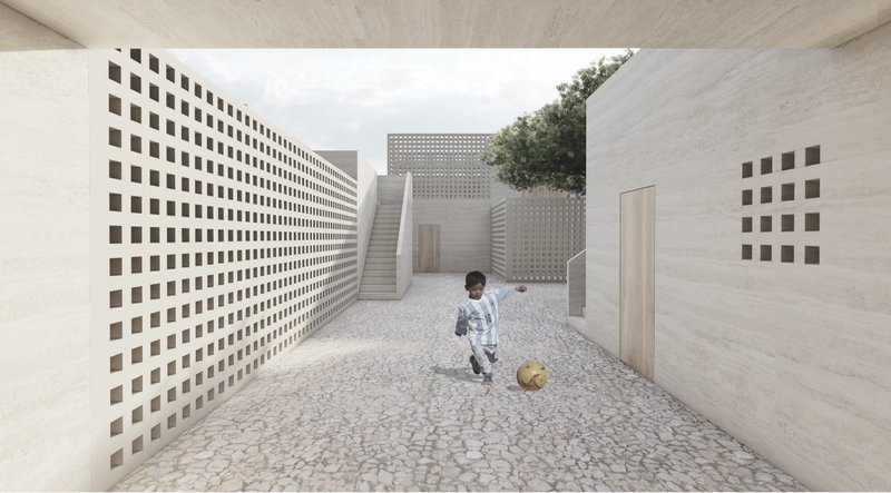A child plays between perforated walls designed for privacy, shade, and natural ventilation.
