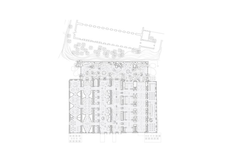 Floor plan drawing showing an interior workspace flanked by a landscaped courtyard and service areas