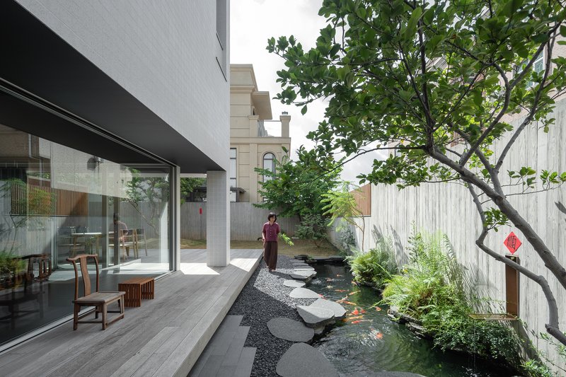 MOZHAO ARCHITECTS Carves Courtyards and Koi Ponds into a Dense Shenzhen Village House