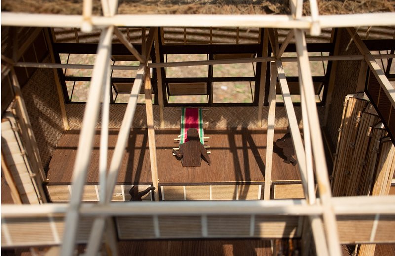 Overhead model view highlighting spatial openness, daylight, and traditional handloom-based learning.