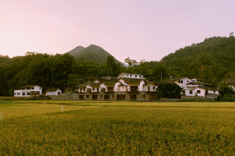kooo architects Disguise a Two-Story Hotel as a Village of Stone Cottages in Rural China