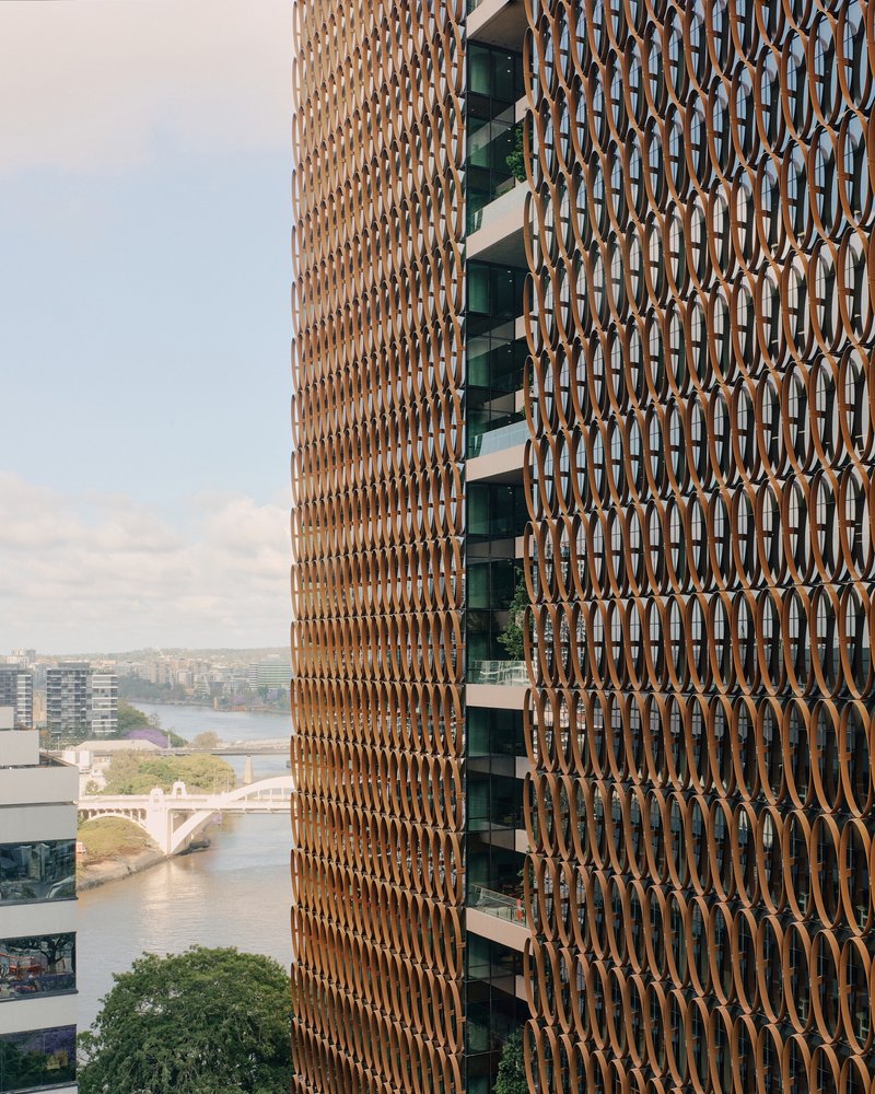 Hassell, REX, and Richards and Spence Wrap a Brisbane Tower in a Climate-Tuned Copper Veil