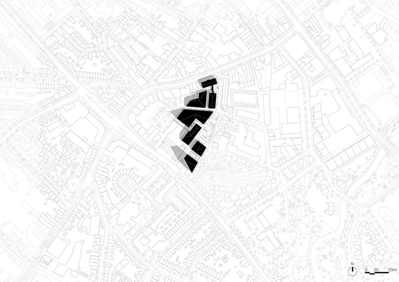 Site plan drawing displaying black building footprints set within a dense network of surrounding urban blocks