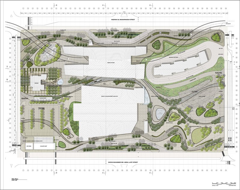 Site plan drawing showing the building footprint surrounded by curving roadways and landscaped zones