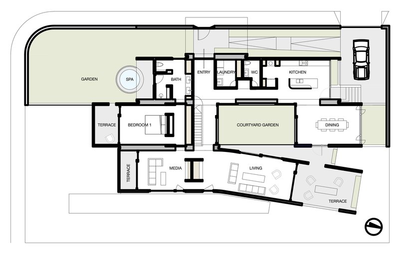 Floor plan drawing showing living spaces and courtyard garden radiating from a central stair core