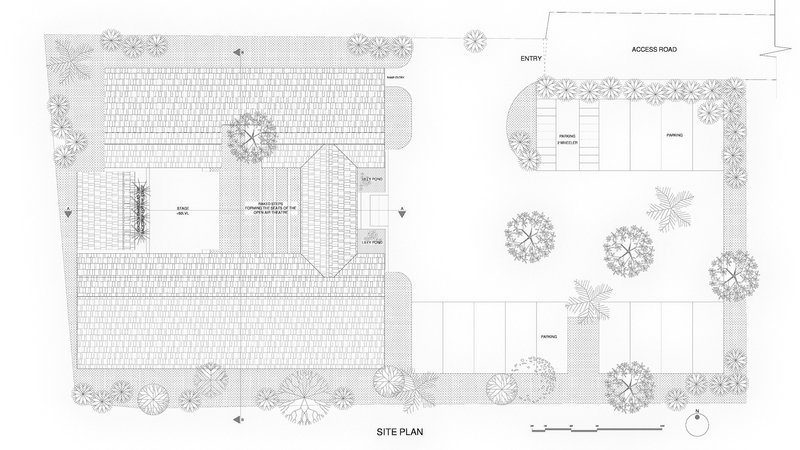 Site plan drawing showing two building volumes surrounded by landscaping and tree canopies