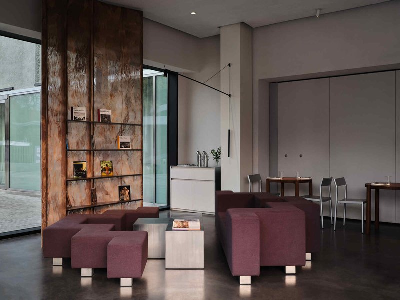 NAAW Nests a Quietly Layered Café Inside Almaty's Reborn Soviet Cinema