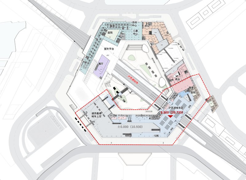 Floor plan drawing showing a hexagonal complex with color-coded zones surrounding a central courtyard with aircraft runway
