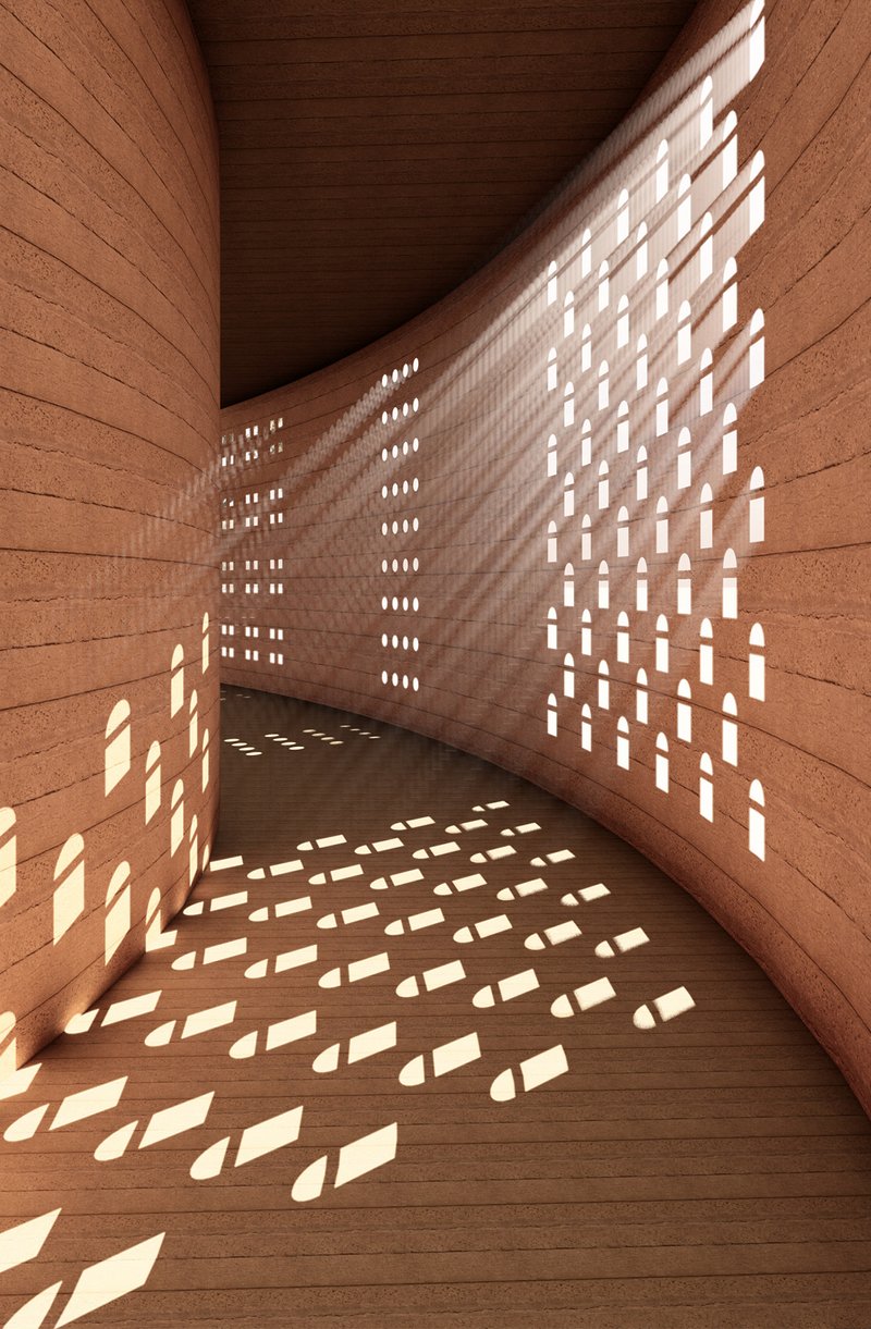 Perforated walls transform natural light into patterned shadows across the curved interior passage.
