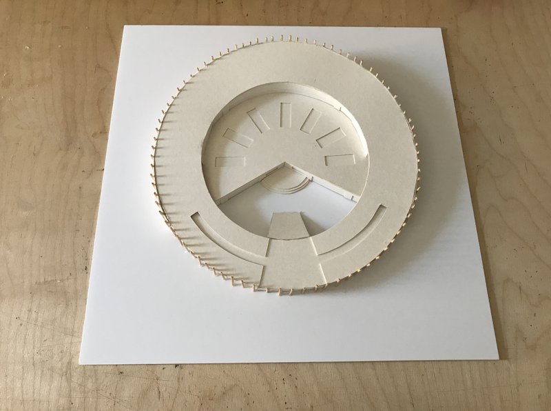 Top view of the kindergarten model highlighting its ring-shaped plan and playful roof access.