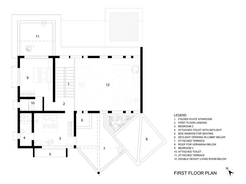 First floor plan drawing showing a central double-height living room with adjacent bedrooms and angular terrace extensions
