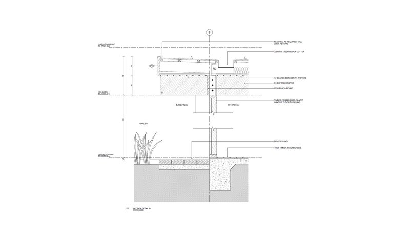 Construction section detail drawing showing wall assembly, foundation, and planted bed with vegetation