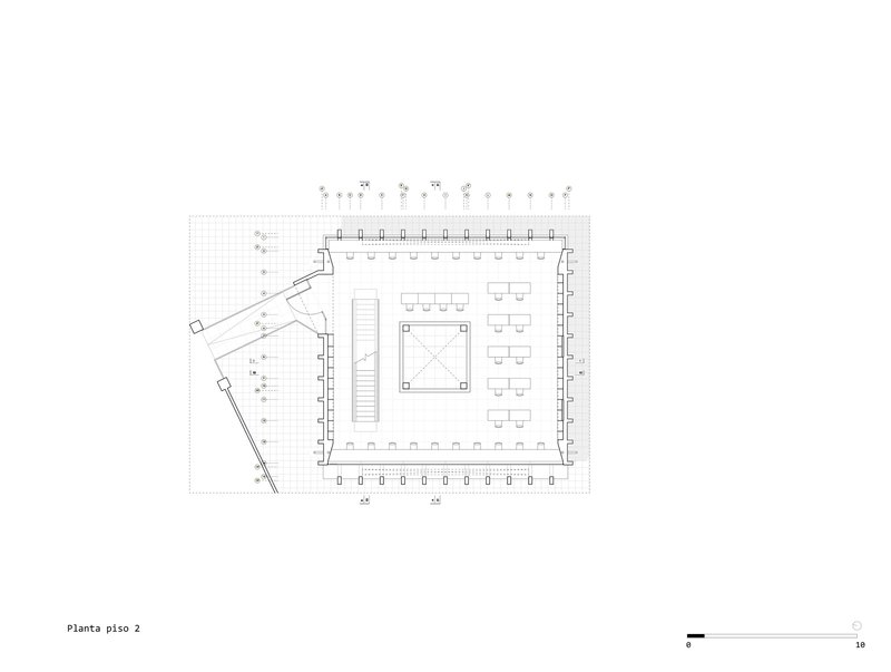 Floor plan drawing showing the upper level with open workspace and diagonal access corridor