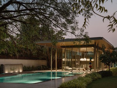 andblack design studio Folds a Concrete Roof Down to the Ground in an Ahmedabad Poolside Pavilion