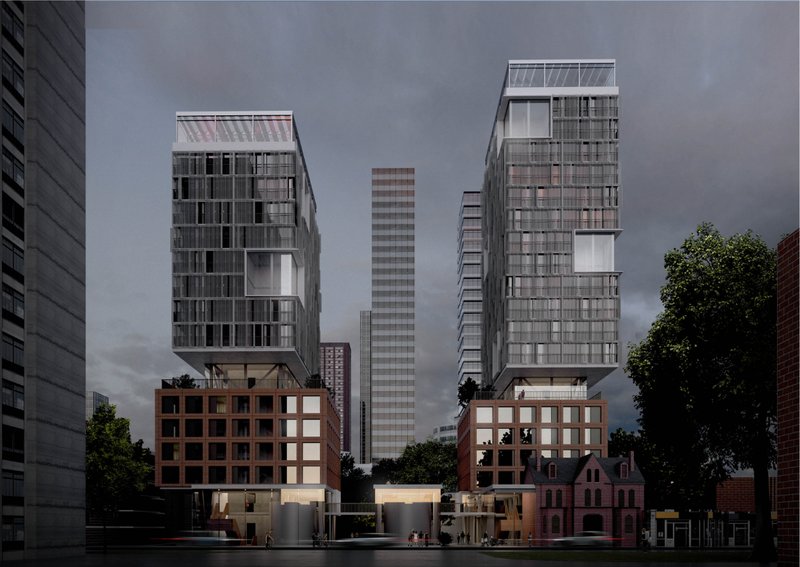 Evening view of the twin housing volumes, podium blocks, heritage structure, and illuminated communal ground plane.