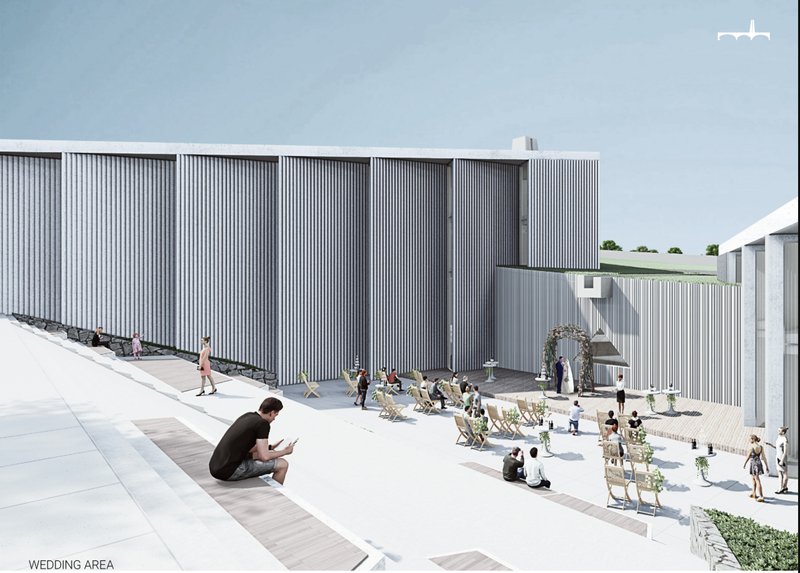 Wedding area framed by minimal white volumes, vertical facades, and open vineyard-facing terraces.
