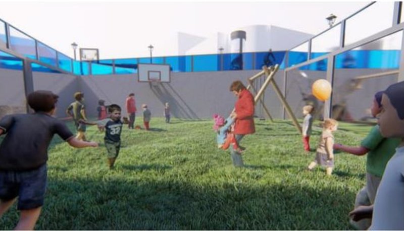 Sunken courtyard play area providing a protected, naturally cooled environment for children.
