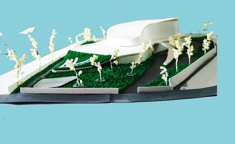 Physical model illustrating the wave-inspired massing integrated with landscape contours.