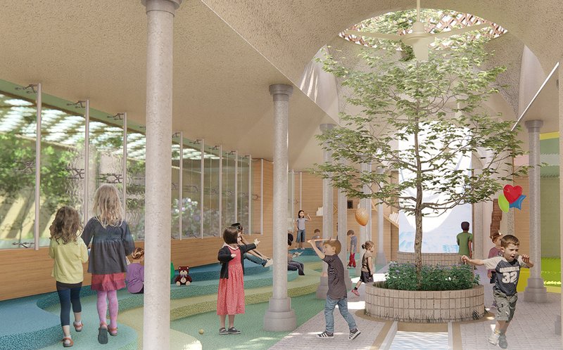 Interior sunken courtyard integrating natural light, vegetation, and passive cooling within a protected play environment.