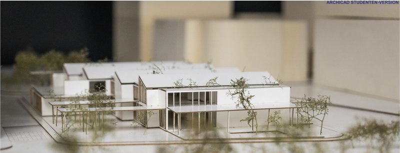 Physical model showcasing the climate-responsive massing and sawtooth roof geometry optimized for daylight and ventilation.
