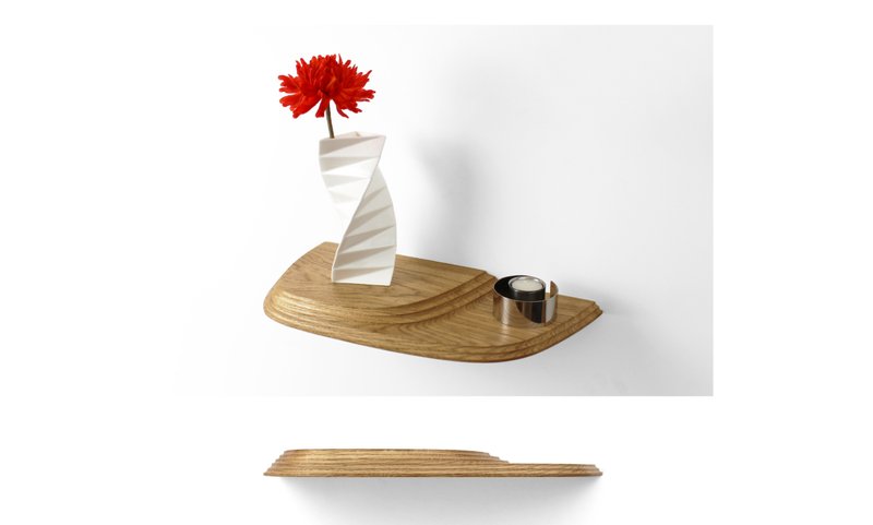 A compact shelf variation demonstrating how sculptural form and function coexist at a smaller scale.