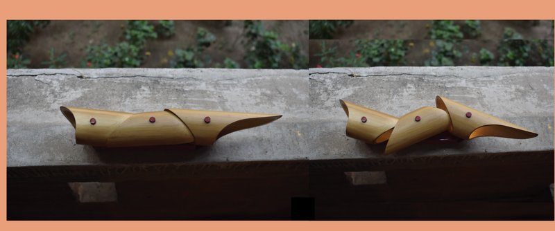 Closed form – Jugnoo in its resting state, expressing a sculptural, bird-inspired silhouette in bamboo.