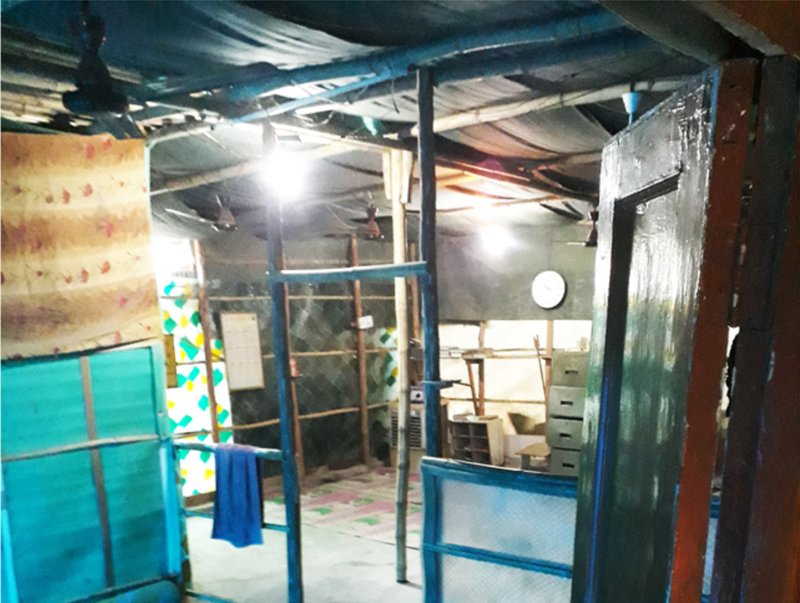 Interior conditions of refugee shelters showing incremental construction and material adaptation over time.