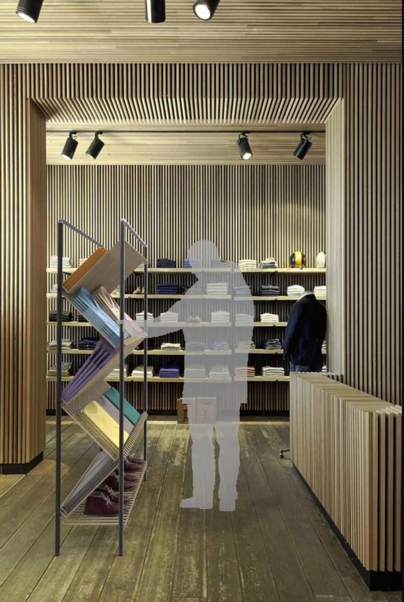 OBLIQUE Bookcase in a retail interior, demonstrating its zig-zag shelving and double-sided accessibility.