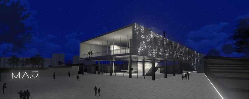 The museum emerges as a luminous urban landmark after dark.