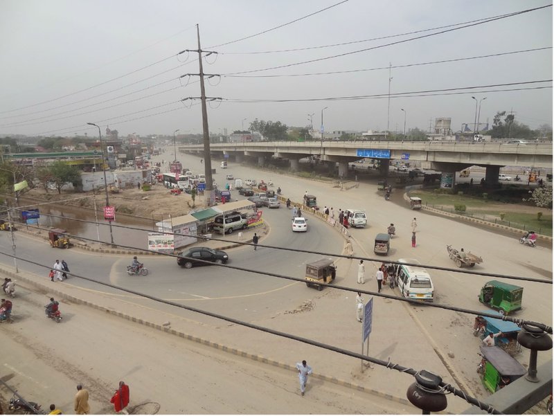 Traffic-dominated junction at Thokar Niaz Baig highlighting the need for pedestrian-first urban intervention.