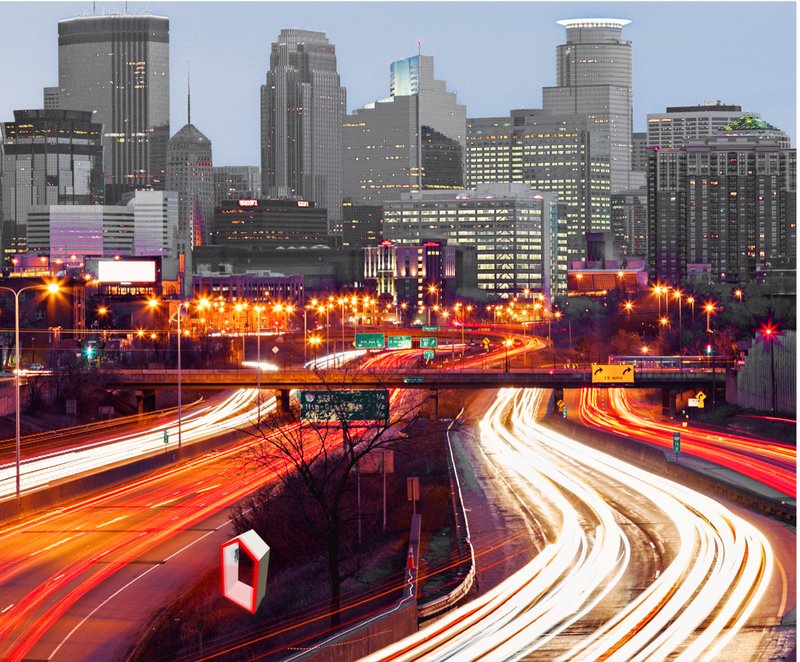 The Urban Box inserted into the fast-paced highway landscape, creating a moment of pause amid continuous urban movement.