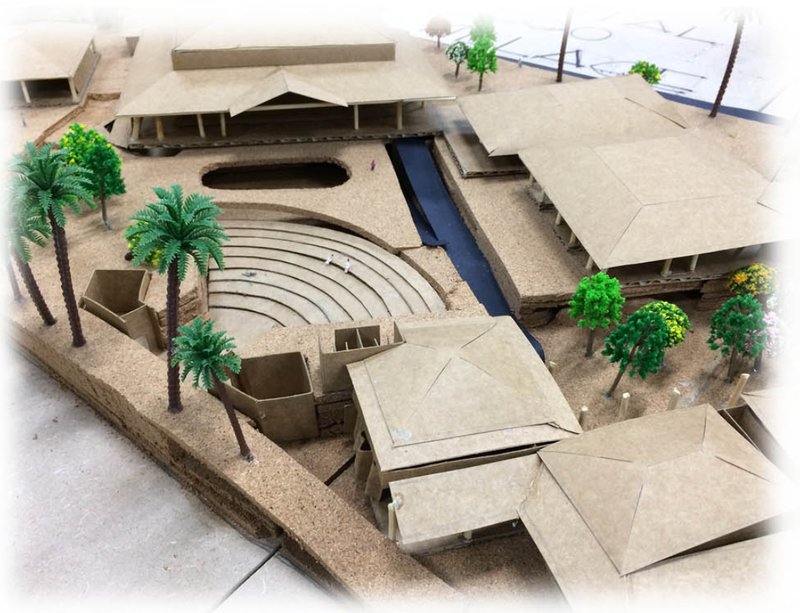 Community core model featuring an open amphitheatre, water channels, and shared public spaces.