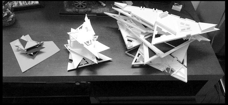 Iterative model studies testing scale, massing, and spatial hierarchy of the vertical cemetery.
