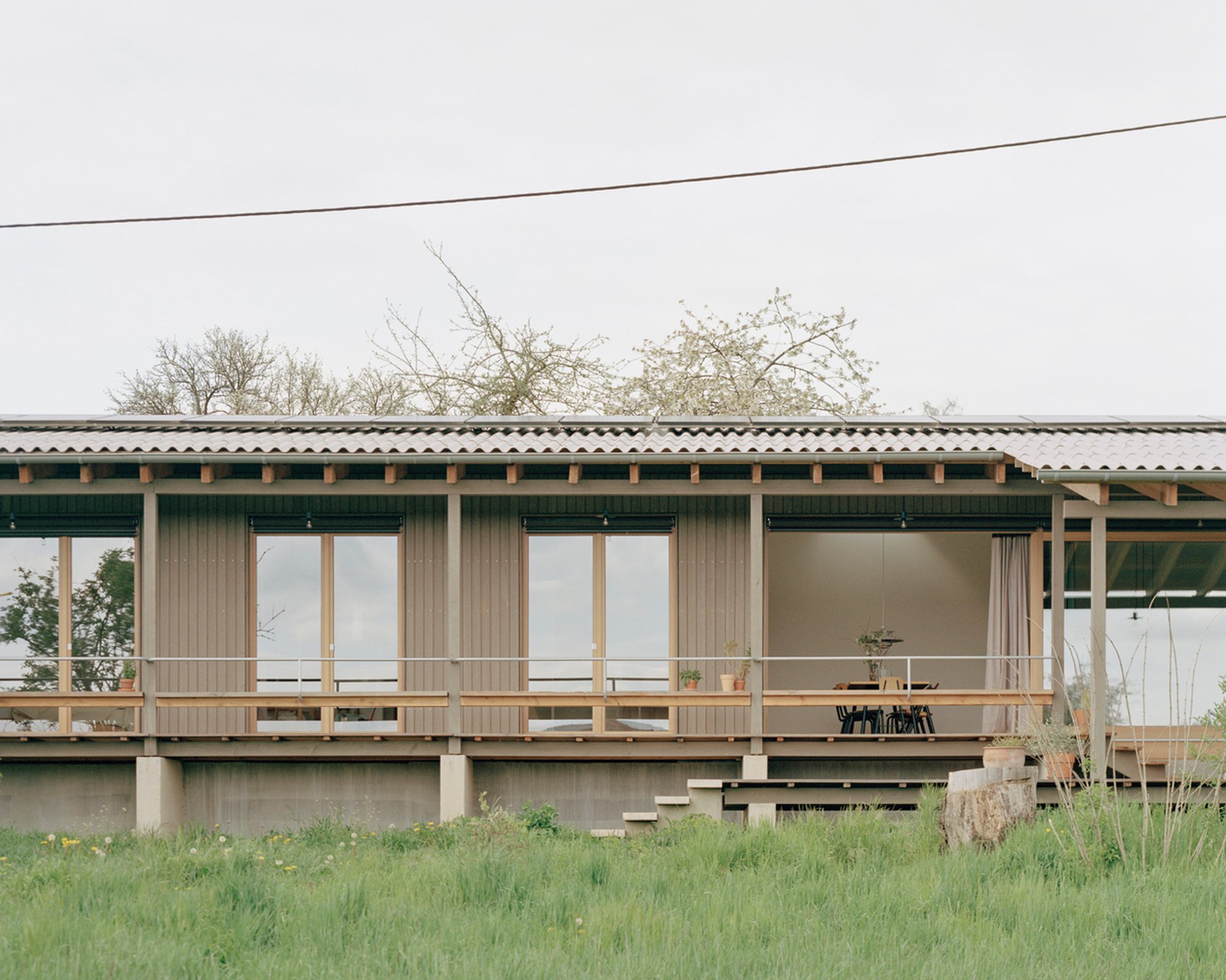A Timber Family Home Embedded in the Rural Landscape of Southwest Germany