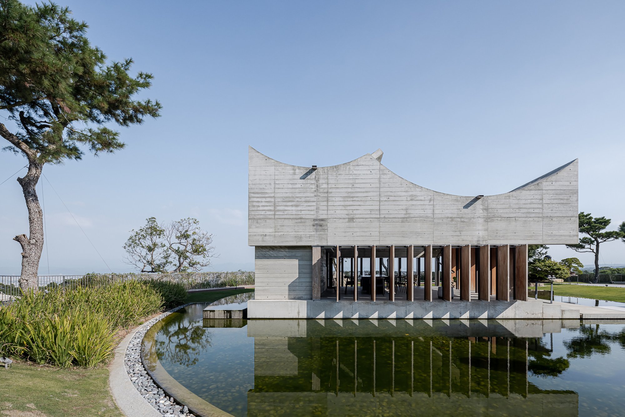 Immerse Yourself in Tranquility at the Watery Oasis of the Watermoon Tea House by Behet Bondzio Lin Architekten