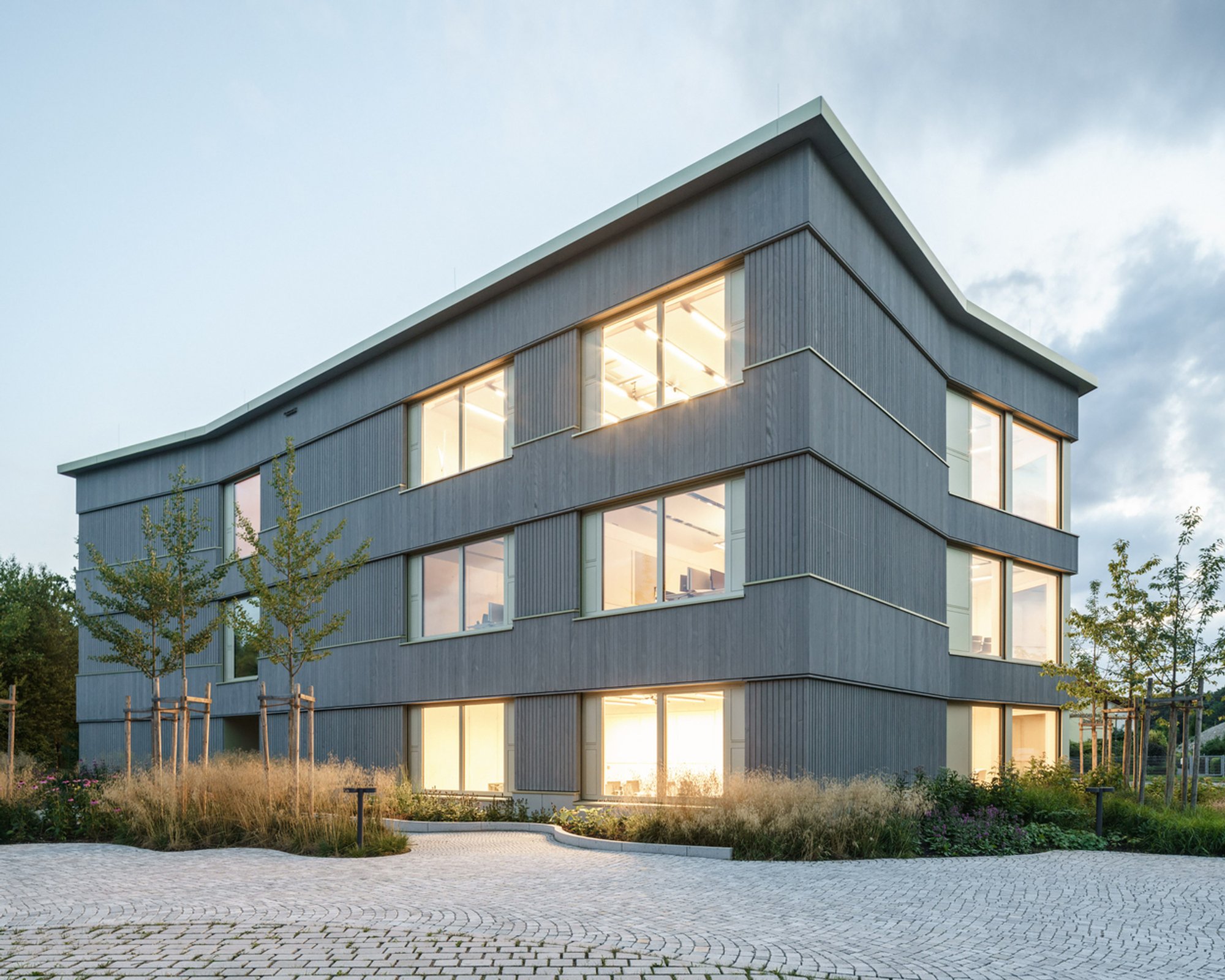 Sustainable Wooden Office Building Design: CADFEM Head Office by nbundm*