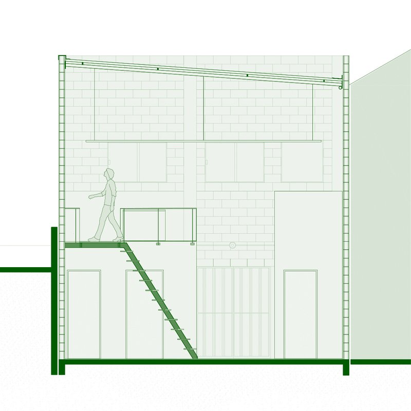 Section drawing showing the diagonal staircase connecting ground level to mezzanine with walking figure
