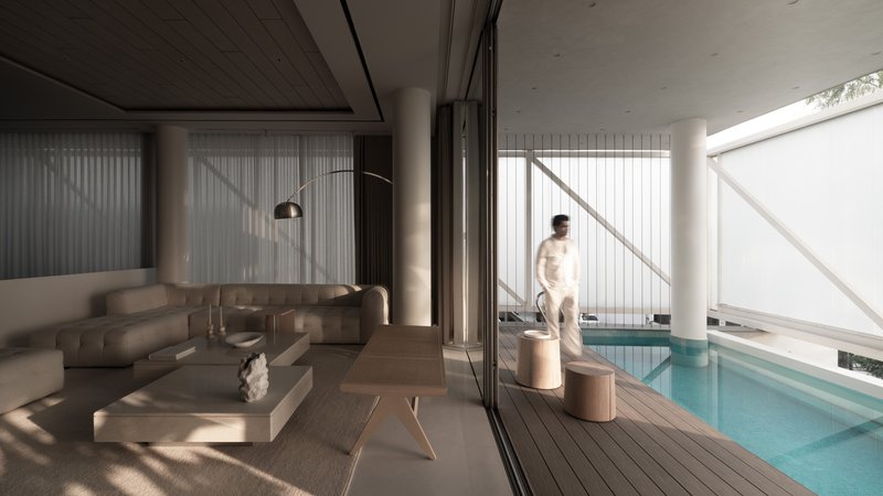 Living area opening onto timber pool deck with a person standing near folded sliding glass doors